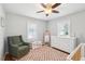 Charming bedroom with a chair, dresser, crib, and bright natural light at 1079 Lockhart St, North Charleston, SC 29405