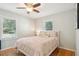 Cozy bedroom with natural light, hardwood floors, and ceiling fan, offering comfort and style at 1079 Lockhart St, North Charleston, SC 29405