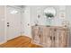 Inviting entryway featuring wood floors, console table, modern decor, and a front door at 1079 Lockhart St, North Charleston, SC 29405