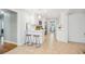 Bright kitchen features white cabinets, stainless steel appliances, a breakfast bar, and a view into other rooms at 1079 Lockhart St, North Charleston, SC 29405