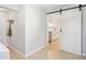 Charming kitchen with a sliding barn door, modern appliances, and ample counter space at 1079 Lockhart St, North Charleston, SC 29405
