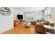 Comfortable living room with a leather couch and a large window for ample natural light at 1079 Lockhart St, North Charleston, SC 29405