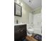Bathroom features a vanity with dark wood cabinets, toilet and a shower-tub combination at 110 Mapperton Ct, Summerville, SC 29485