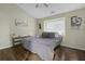 A cozy bedroom with a ceiling fan, a queen-size bed, and neutral-toned walls at 110 Mapperton Ct, Summerville, SC 29485