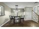 Dining area with hardwood floors and a modern light fixture offering a cozy spot for meals at 110 Mapperton Ct, Summerville, SC 29485