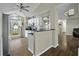 Bright kitchen featuring white cabinets, granite counters, and a large window for lots of natural light at 110 Mapperton Ct, Summerville, SC 29485