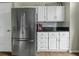 Kitchen featuring white cabinets and a stainless steel refrigerator at 110 Mapperton Ct, Summerville, SC 29485