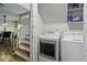 A well-lit laundry area is conveniently located near the stairs and features modern appliances at 110 Mapperton Ct, Summerville, SC 29485