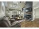 Inviting living room featuring a fireplace and large windows with a vaulted ceiling providing lots of natural light at 110 Mapperton Ct, Summerville, SC 29485