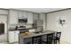 Modern kitchen featuring white cabinets, stainless steel appliances, and a kitchen island with a sink at 111 Sandy Oaks Ln, Cross, SC 29436