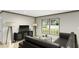 Bright living room with hardwood floors, a black leather sofa, and a large window overlooking the yard at 111 Sandy Oaks Ln, Cross, SC 29436