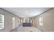 Bright living room featuring a kitchen island, wood-look floors, and white walls at 111 Sandy Oaks Ln, Cross, SC 29436