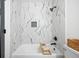 Modern bathroom with tub and shower and decorative white marble tile at 1114 Margaret Dr, Ladson, SC 29456