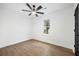 A neutral bedroom with a ceiling fan, window and view to the outdoors, and wood-look flooring at 1114 Margaret Dr, Ladson, SC 29456