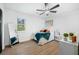 A bright bedroom is decorated with modern fixtures, trendy wall art, and eye-catching window mirror at 1114 Margaret Dr, Ladson, SC 29456