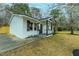 Charming exterior view of this painted brick home featuring dark shutters and a cozy front porch at 1114 Margaret Dr, Ladson, SC 29456