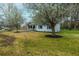 Landscaped lawn surrounding this beautiful home with blossoming trees providing shade at 1114 Margaret Dr, Ladson, SC 29456