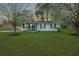 Charming single story home with fresh landscaping, green lawn, and blooming trees at 1114 Margaret Dr, Ladson, SC 29456