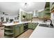 Bright and airy kitchen with stylish lighting, white countertops and stainless steel appliances at 1114 Margaret Dr, Ladson, SC 29456