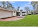 Charming backyard offers brick patio and screened-in porch at 123 Sharon Dr, Walterboro, SC 29488