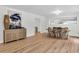Dining room with hardwood flooring, stylish decor and fixtures, and a large decorative art piece at 123 Sharon Dr, Walterboro, SC 29488