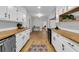 Bright, functional kitchen with white cabinets, butcher block countertops, and hardwood flooring at 123 Sharon Dr, Walterboro, SC 29488