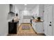 Well-designed kitchen featuring white cabinets, wooden counters, and an open layout at 123 Sharon Dr, Walterboro, SC 29488