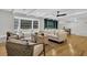 Bright living room features a large window seat, stylish furnishings, and white ceiling beams at 123 Sharon Dr, Walterboro, SC 29488