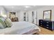 Bright main bedroom boasts an open closet and ensuite bath, plus a comfy sitting area and light hardwood floors at 123 Sharon Dr, Walterboro, SC 29488