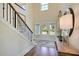 Elegant entryway featuring hardwood floors, staircase, and natural light at 136 Grange Cir, Summerville, SC 29486