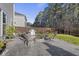 A large patio with a fire pit, grill, and seating offers ample space for outdoor enjoyment at 1376 Wild Goose Trl, Summerville, SC 29483
