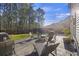 The backyard features a stamped concrete patio with a fire pit and a relaxing lounge area at 1376 Wild Goose Trl, Summerville, SC 29483