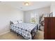 Bedroom with a bed that features a striking blue plaid comforter at 1376 Wild Goose Trl, Summerville, SC 29483
