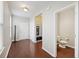 Welcoming entryway with hardwood floors, natural light, and convenient access to the half bathroom at 1376 Wild Goose Trl, Summerville, SC 29483
