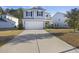 Attractive two-story home with a spacious driveway and manicured front yard and a two-car garage at 1376 Wild Goose Trl, Summerville, SC 29483