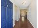 Inviting foyer with dark wood floors, a blue front door, and a view into the open-concept living area at 1376 Wild Goose Trl, Summerville, SC 29483