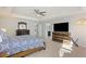 Large main bedroom with tray ceilings, ceiling fan, carpet and ample natural light at 1376 Wild Goose Trl, Summerville, SC 29483