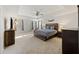 Spacious main bedroom with tray ceiling, fan, plush carpet, and ample natural light at 1376 Wild Goose Trl, Summerville, SC 29483