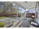 Relaxing screened porch with seating overlooking a backyard at 1376 Wild Goose Trl, Summerville, SC 29483