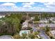 Aerial view of a neighborhood with wooded area and a community pool at 138 Taylor Cir, Goose Creek, SC 29445