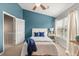 Comfortable bedroom with a window for natural light and blue accent wall at 138 Taylor Cir, Goose Creek, SC 29445