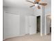 Bedroom featuring neutral carpet, a ceiling fan, and white doors to the closet at 138 Taylor Cir, Goose Creek, SC 29445