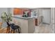 Eat-in kitchen featuring wood cabinetry, stainless appliances, and a bar top for additional seating at 138 Taylor Cir, Goose Creek, SC 29445