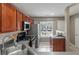 Well-lit kitchen with wood cabinets, stainless steel appliances, and a sink with a modern faucet at 138 Taylor Cir, Goose Creek, SC 29445