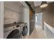 Convenient laundry closet featuring a sliding barn door and Samsung washer and dryer at 138 Taylor Cir, Goose Creek, SC 29445