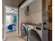 Laundry room featuring a sliding barn door and new Samsung washer and dryer at 138 Taylor Cir, Goose Creek, SC 29445