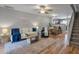 Open-concept living room and kitchen with hardwood floors and stairs at 138 Taylor Cir, Goose Creek, SC 29445