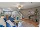 Spacious living room with stairs, dining area, and comfortable seating, illuminated by natural light at 138 Taylor Cir, Goose Creek, SC 29445