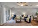 Bright living room with a sliding glass door, hardwood floors, and comfortable seating at 138 Taylor Cir, Goose Creek, SC 29445