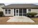 Back patio with a screened-in porch, and a small garden area in a well-maintained backyard at 1529 Wellesley Cir, Mount Pleasant, SC 29466